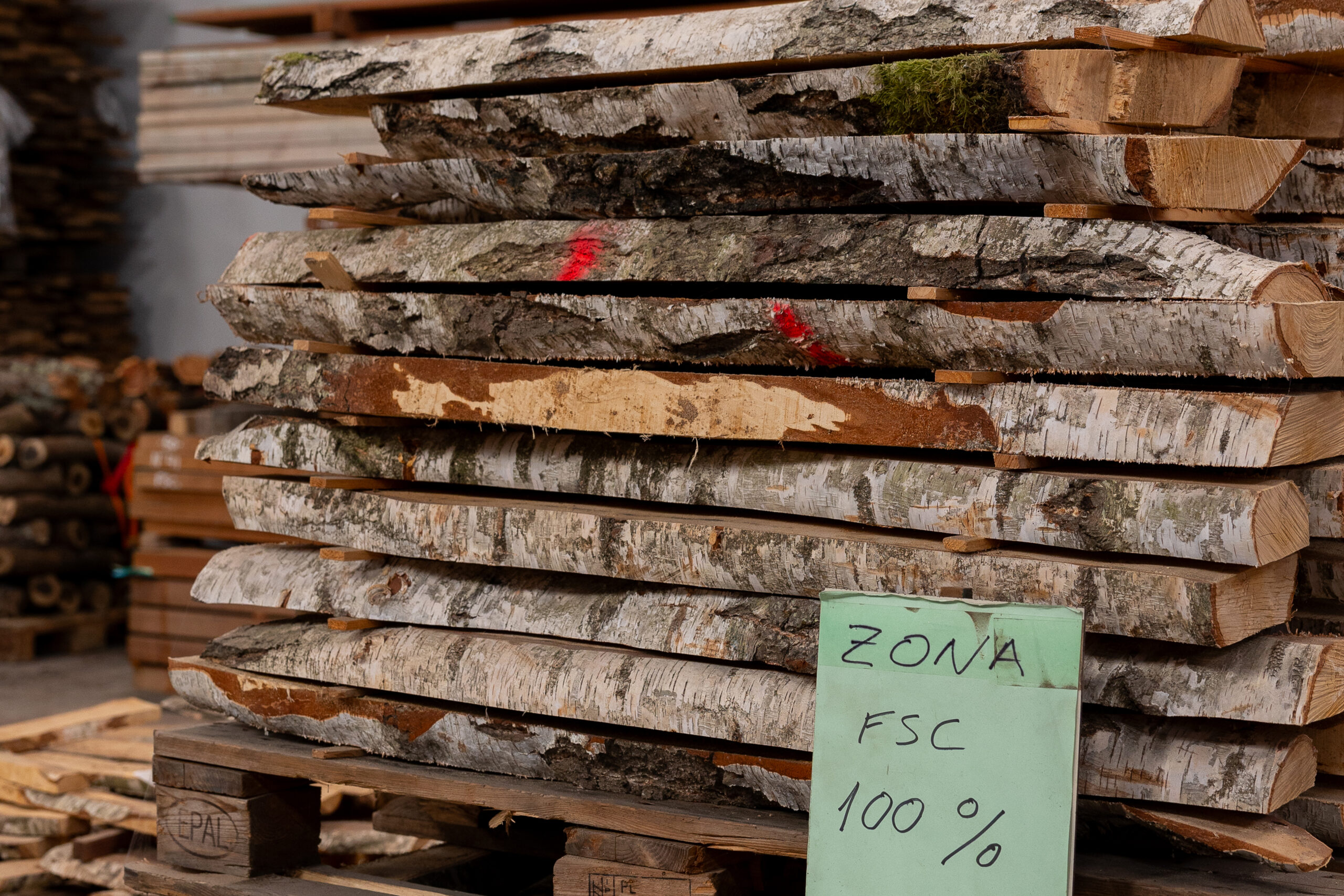 100% FSC certified wood pieces stacked and stored in a warehouse